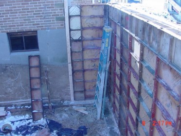 Underpinning existing house foundation from basement addition